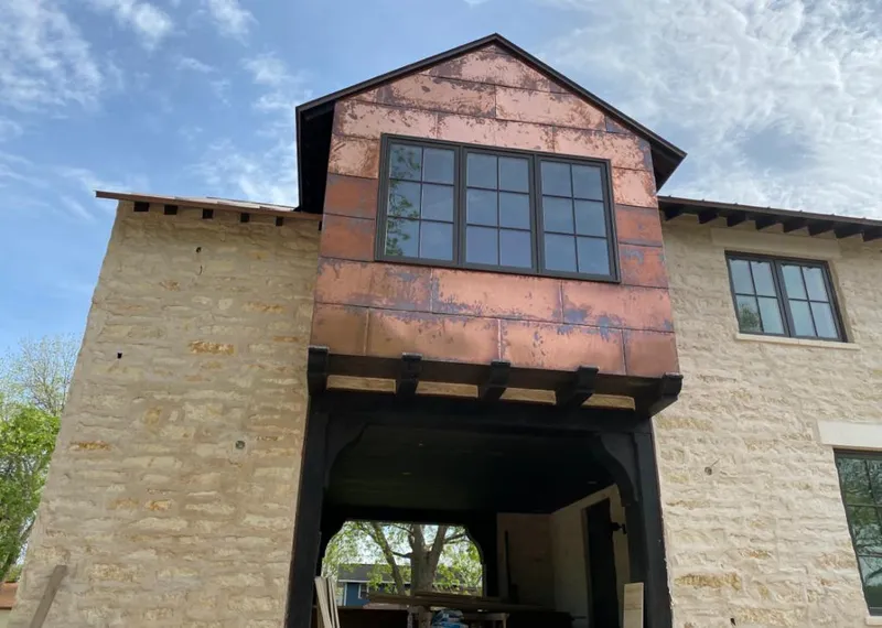 Copper metal panel facade on a stone building for Metal Roof Coating in Honey Brook